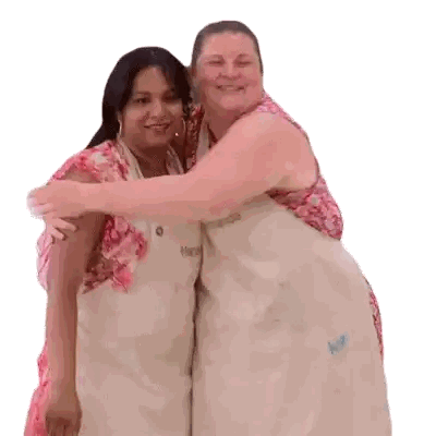 Two Women Hugging One Wearing Nikki Apron Sticker