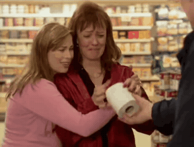 Two Women Hugging With Toilet Paper Roll GIF