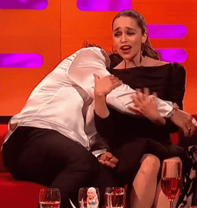 Two Women Hugging With Wine Glasses GIF