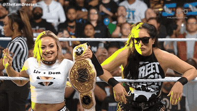 Two Women In A Wrestling Ring One Wearing A Shirt That Says Reet On It GIF