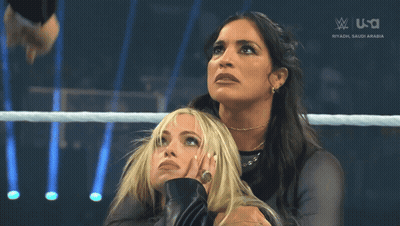 Two Women In A Wrestling Ring With A Saudi Arabia Logo On The Bottom Right GIF