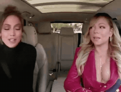 Two Women In Back Seat One In Pink Jacket GIF