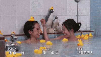 Two Women In Bathtub With Rubber Ducks On Head GIF