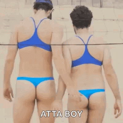 Two Women In Bikinis Are Holding Hands On A Beach . GIF