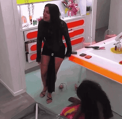 Two Women In Black Dresses GIF