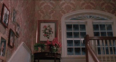 Two Women In Blue And Black Dresses GIF