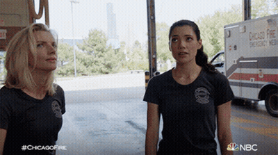 Two Women In Front Of Ambulance Saying Chicago Fire GIF