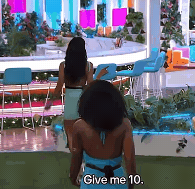 Two Women In Front Of Bar Saying Give Me 10 GIF