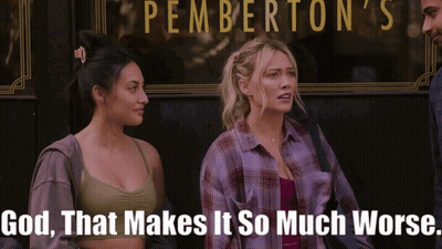 Two Women In Front Of Pemberton's Restaurant GIF
