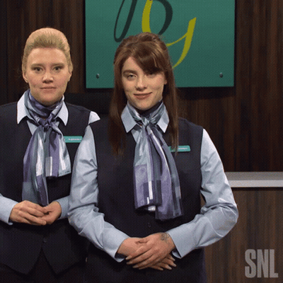 Two Women In Front Of SNL Sign GIF