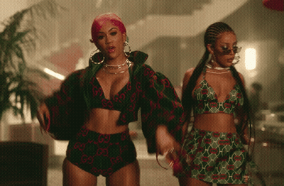 Two Women In Gucci Outfits GIF