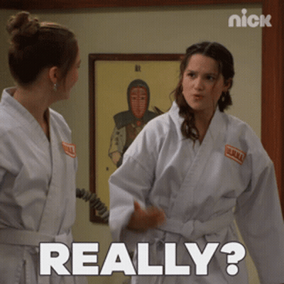 Two Women In Karate Uniforms Are Standing Next To Each Other And One Of Them Is Asking The Other " Really " GIF