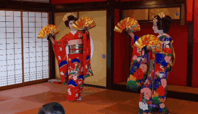 Two Women In Kimonos Dancing With Fans GIF