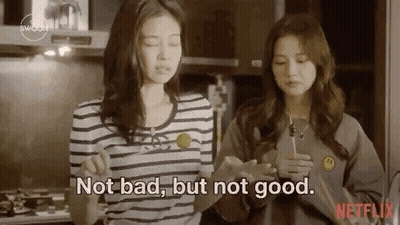 Two Women In Kitchen One Holding Lollipop GIF