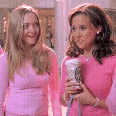 Two Women In Pink Sweaters One Holding Starbucks Coffee GIF