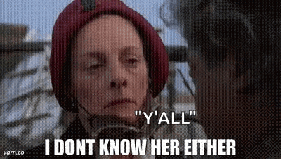 Two Women In Red Hats Talking GIF
