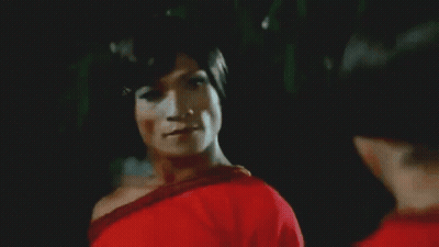 Two Women In Red Shirts Dancing In Front Of Crowd With Man In Black P Shirt GIF