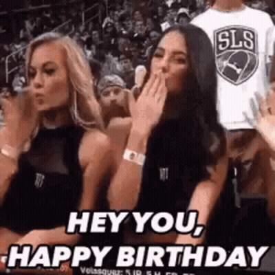 Two Women In Stands One Covering Mouth GIF