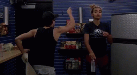 Two Women In Store One Holding Water Bottle GIF