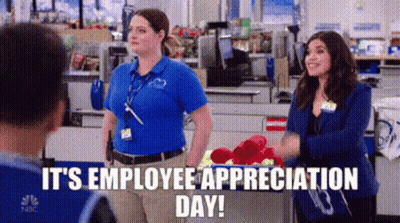 Two Women In Store With Man Talking To Them GIF