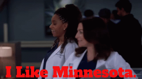 Two Women In White Coats With The Words I Like Minnesota On The Top GIF