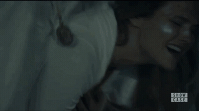 Two Women In White Dresses Dancing In Dark Room GIF