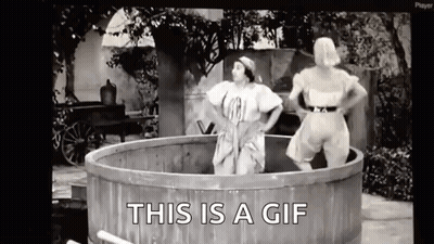 Two Women In Wooden Tub Saying This Is A GIF