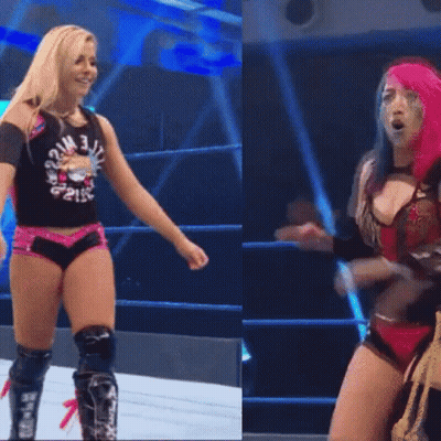 Two Women In Wrestling Ring One With Knee Pads GIF