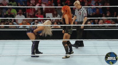 Two Women In Wrestling Ring With World Of Wrestling Logo GIF