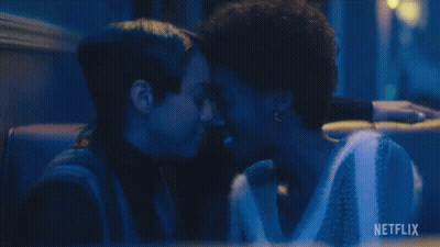 Two Women Kissing Dark Room Netflix Logo GIF