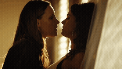 Two Women Kissing In Dark Room GIF