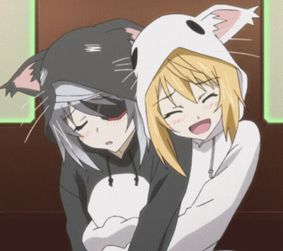Two Women Kissing In Front Of Light Bulb GIF