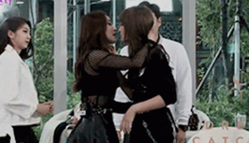 Two Women Kissing In Room GIF
