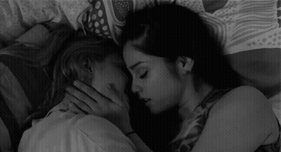 Two Women Kissing On Bed GIF