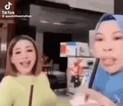 Two Women Laughing At Phone GIF