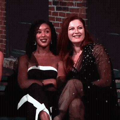 Two Women Laughing On Bench GIF