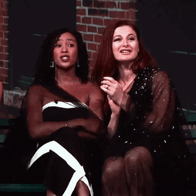 Two Women Laughing On Bench GIF