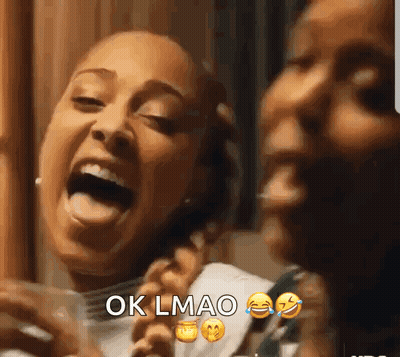 Two Women Laughing One Holding Cell Phone GIF