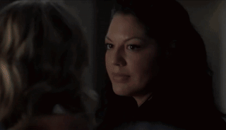Two Women Laying On Bed Kissing In Dark GIF
