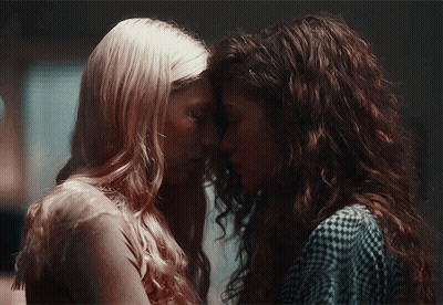 Two Women Looking At Each Other Eyes Closed GIF