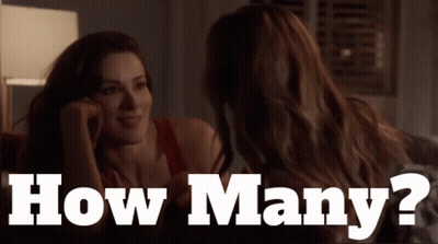 Two Women Looking At Each Other Saying How Many GIF