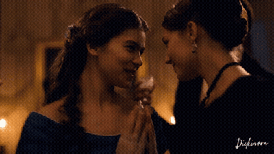 Two Women Looking At Each Other With The Word Dickinson On The Bottom Left GIF