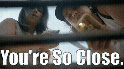 Two Women Looking Through A Window With The Words " You 'Re So Close " On The Bottom GIF