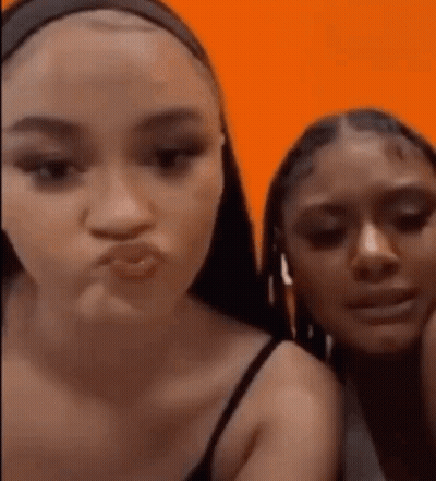 Two Women Making Faces GIF