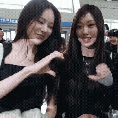 Two Women Making Heart With Hands