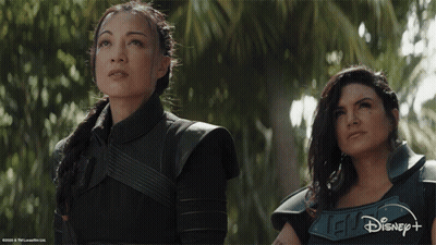 Two Women Next To Disney Logo GIF