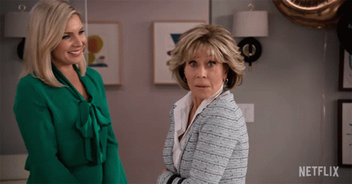 Two Women Next To Netflix Logo GIF