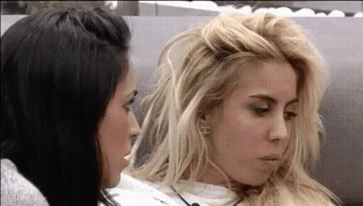 Two Women On Couch, One Messy Hairdo GIF