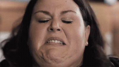 Two Women On Couch, One Messy Hairdo GIF