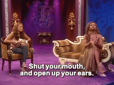 Two Women On Couch One Saying Shut Your Mouth And Open Your Ears GIF
